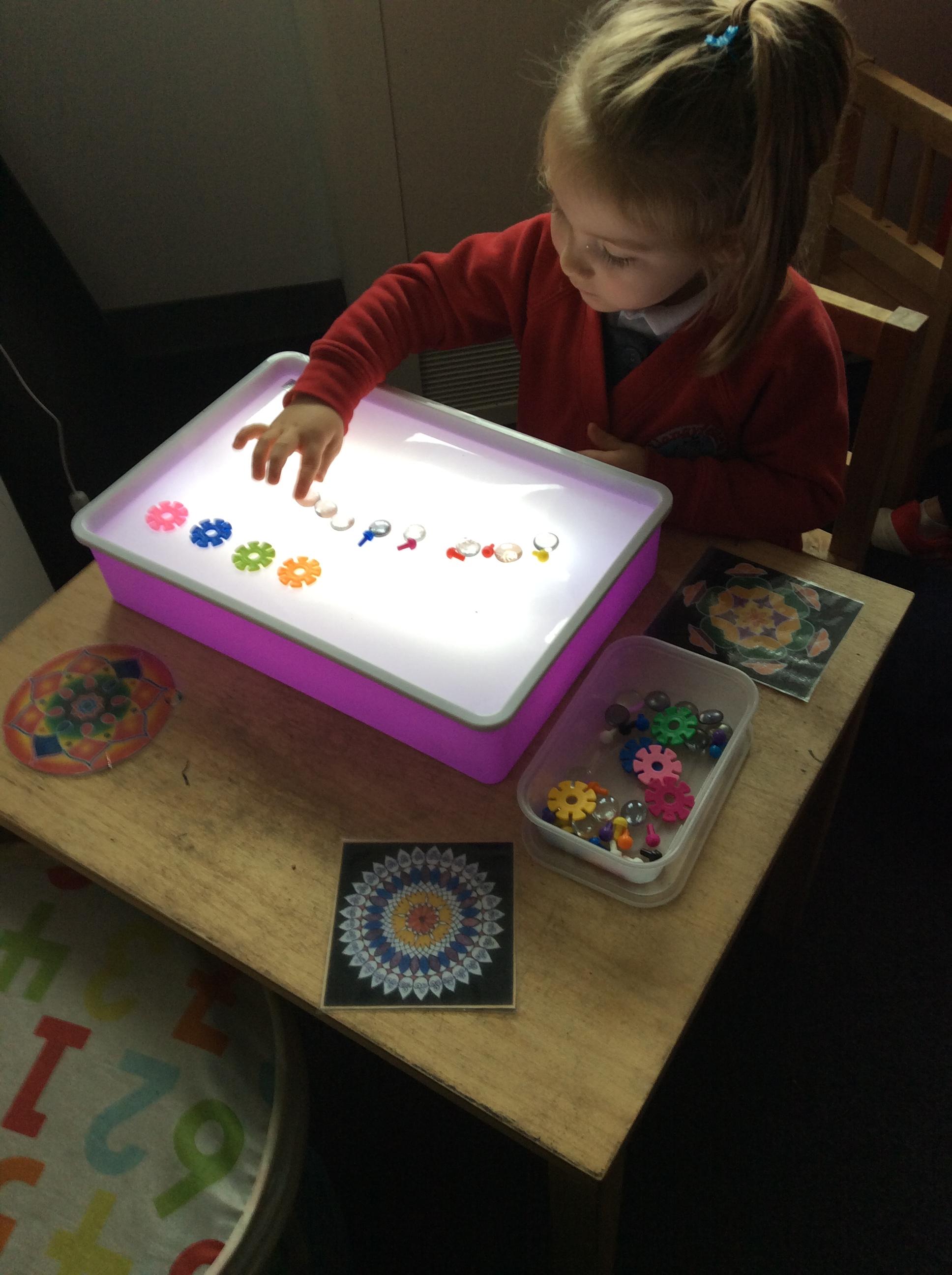 Making Rangoli pattern on the light box.